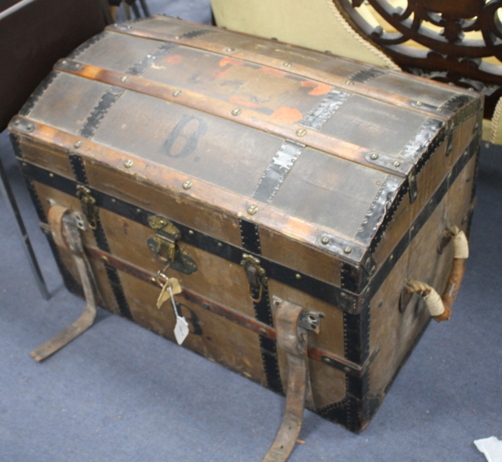 An early 20th century cabin trunk by Friedrich Wallauer of Darmstadt, with black painted metal banding, brass mounts and original strip